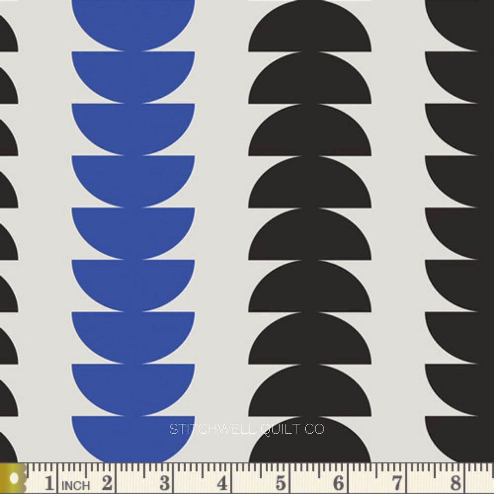 A repeating geometric pattern featuring vertical columns of stacked semi-circles in blue and black on a white background., with a measuring ruler along the bottom edge.